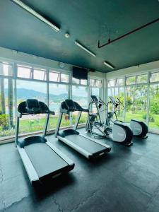 a gym with three exercise bikes and windows at ONE PAVILLION PLACE in Cebu City