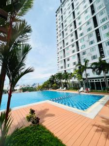a swimming pool in front of a tall building at ONE PAVILLION PLACE in Cebu City