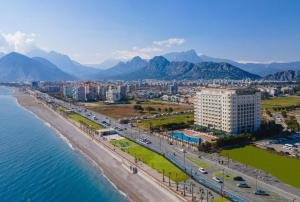 an aerial view of a beach and a city at Crowne Plaza Antalya by IHG in Antalya