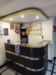 a bar in a restaurant with a sign on the wall at Deluxe Miraflores in Miraflores