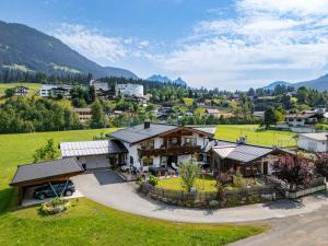 an aerial view of a house in the mountains at Appartements Sonntal Einkehr in Fieberbrunn