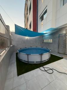 a hot tub on a balcony of a building at Reda Appartements Al Hoceima in Al Hoceïma