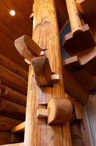 a wooden spiral staircase in a room with wooden ceilings at Villa Rusutsu in Rusutsu +98 photos