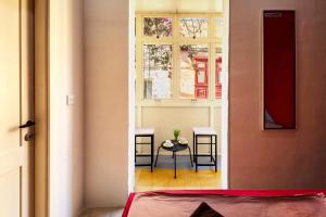 a view of a room with a table and a window at Ensuite budget twin room at quiet and friendly townhouse in Sliema