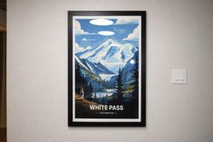 a picture of a white pass sign on a wall at Tall Timber in Packwood