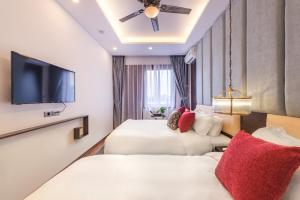 Giường trong phòng chung tại Splendid Hotel & Spa