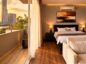 a bedroom with a bed and a view of a city at Amana Boutique Riverside - An Khanh in Ho Chi Minh City