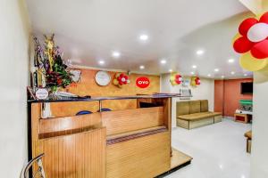 a kitchen with a counter with a counter top at Hotel O Lord Shiva in Bankipur