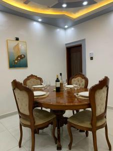 a dining room with a wooden table and chairs at Villa de 2 chambres in Porto-Novo +34 photos