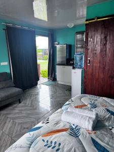 a bedroom with a bed in the middle of a room at Dream lodge in Rangiroa