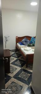 a bedroom with a bed and a tiled floor at HotelSueñosCafeteros in Montenegro