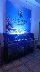 a large aquarium sitting in a room with at HotelSueñosCafeteros in Montenegro +11 photos