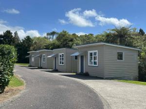 a row of modular homes on a road at Stratford Motel & Holiday Park in Stratford