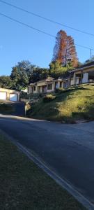 a house on a hill next to a street at RestZone Healing Guest Suite in Pietermaritzburg