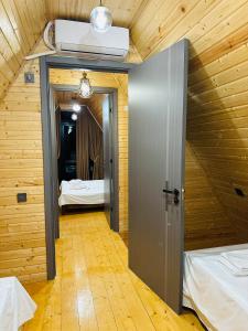 a room with a door leading to a bedroom at Hiyadel balcony in Sadgeri