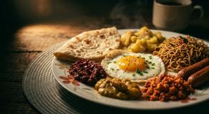 a plate of food with eggs and bread on a table at Ella Claython Hills in Ella