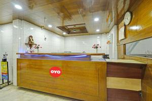 a counter in a room with aoked at Hotel O Grand Pallavaram in Chennai +20 photos