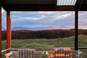 a view of the mountains from a train window at Six-Ten Shores in Dolphin Sands +17 photos