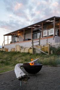 a fire pit in front of a building at Six-Ten Shores in Dolphin Sands