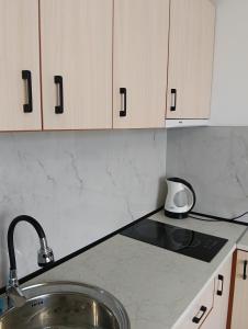 a kitchen with a sink and a counter top at Sea Breeze Studio at Fort Noks Resort in Sunny Beach +20 photos
