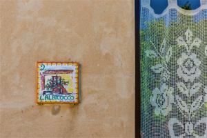a box on the side of a wall next to a window at Anastè in Buseto Palizzolo