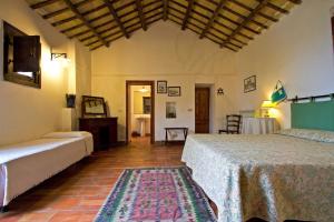 a room with two beds and a table in it at Anastè in Buseto Palizzolo