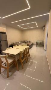a dining room with tables and chairs in it at إقامة الرمال الذهبية in Les Hamiane