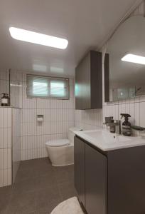 a bathroom with a toilet and a sink at 스테이 모슬 in Daejeong +11 photos