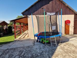 a trampoline in front of a building at Casa Rodica Turda in Turda +27 photos