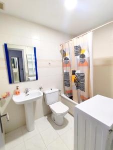 a bathroom with a toilet and a sink at Paraiso La Mata in La Mata +22 photos