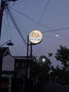 a sign for an amazon sign on top of a building at Ambarosed Homestay in Ngaglik