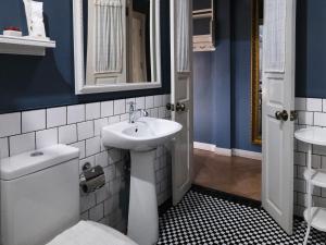 a bathroom with a white toilet and a sink at Maison Dang Boutique Hotel in Chiang Mai +87 photos