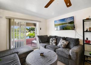 a living room with a couch and a table at Cozy Lakefront Home in Lake Wales