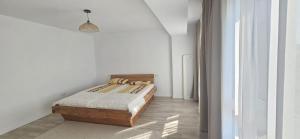 a bedroom with a bed in a white room at Benning Haus Gandia in Gandía