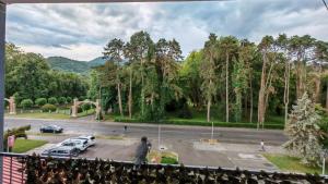 a view of a parking lot with cars parked at Koviljača park in Banja Koviljača