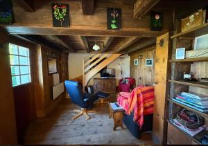 a living room with a couch and a chair in a room at Chalet 1813 Nature & Panorama in Montreux
