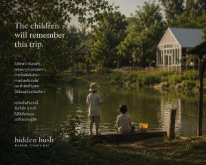 two children are fishing in a pond at Hidden hush hideaway in Ban Mo