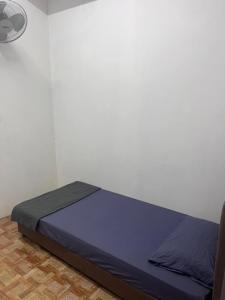 a bedroom with a bed in a room at NR Guest House in Kangar