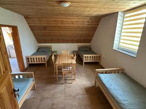a room with couches and a table and chairs at Vila Stella Vita in Chrbonín +20 photos