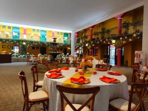 a dining room with a table and chairs in a building at Hotel Tartar in Cajamarca +286 photos