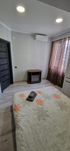 a bedroom with a large bed in a room at Mircea cel Batrin apartament in Chişinău