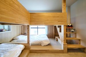 a bedroom with two bunk beds and a staircase at Inside Sangreen - Vacation STAY 22712 in Tokyo