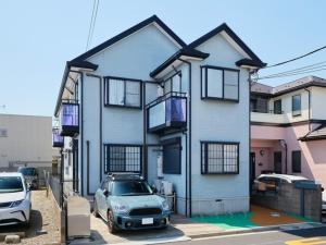 a house with a car parked in front of it at Inside Sangreen - Vacation STAY 22712 in Tokyo