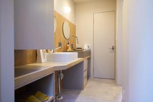 a bathroom with a sink and a mirror at Inside Sangreen - Vacation STAY 22714 in Tokyo