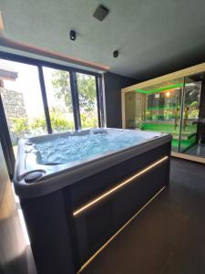 a large jacuzzi tub in a room at Monte SPA Villas in Banya