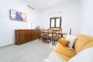 a living room with a couch and a table at Bidderosa in Orosei