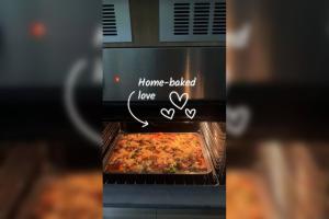 a microwave oven with a dish of food in it at Gokarna Homestay in Kathmandu