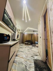 a hotel room with a lobby with a marble floor at Nior luxury stays in Ghaziabad +14 photos
