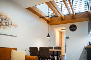 a living room with a table and chairs at CASTLE apartments Premium - City Center in Spišské Podhradie