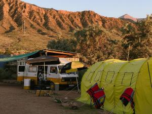 a group of tents in front of a mountain at Urban Monkey Summer Camp in Kaji-Say +27 photos